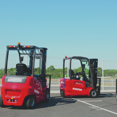 3 forklifts outside