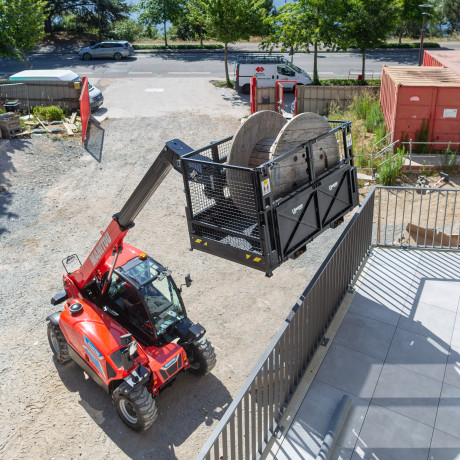 MT on construction with material basket