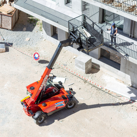 mt on construction field with Material basket